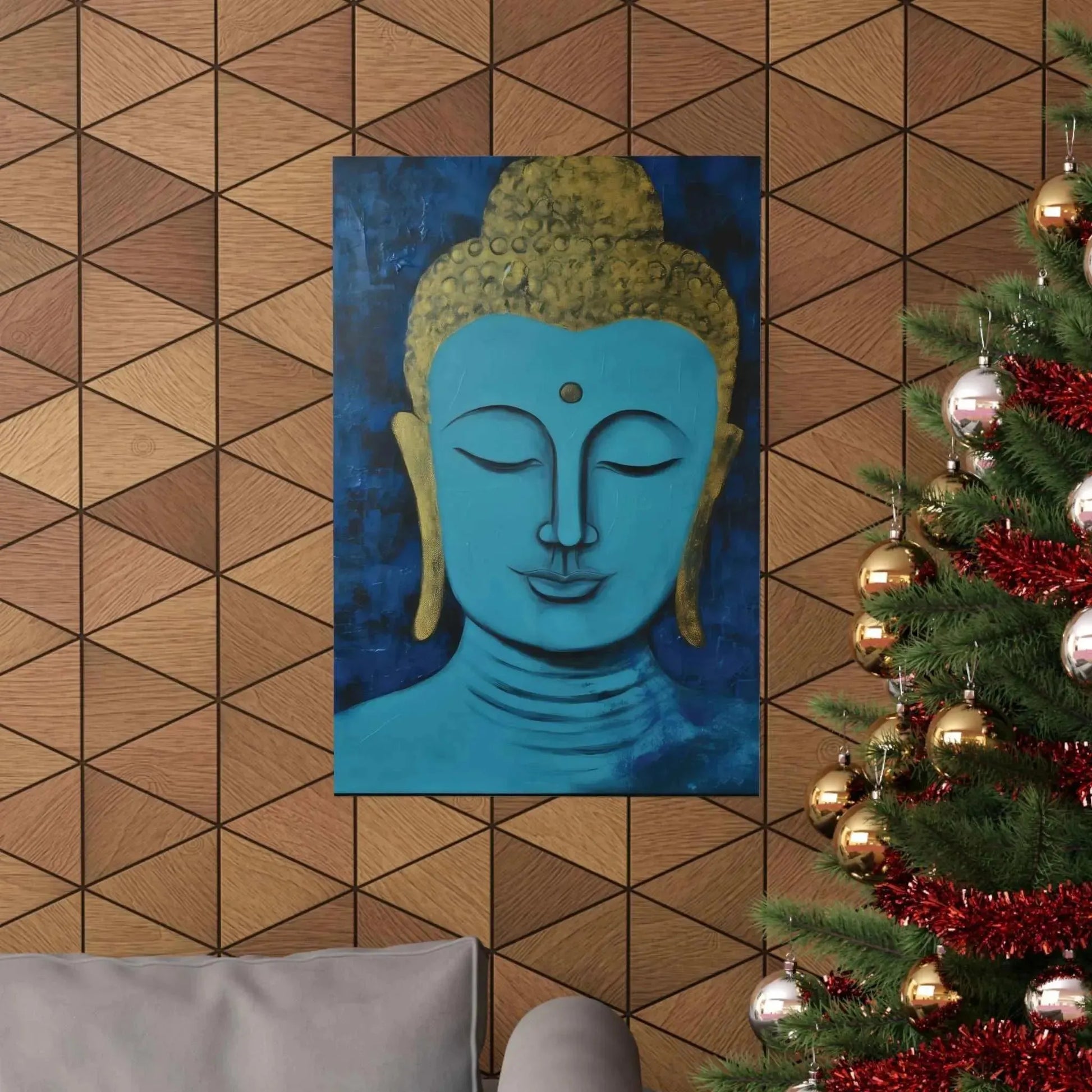 The "Tranquil Buddha Head Canvas" from Printify, featuring a serene meditation yoga pose, is displayed on a geometric wooden wall. Nearby, a decorated Christmas tree glistens with gold and red ornaments, with a gray couch partially visible beside it.