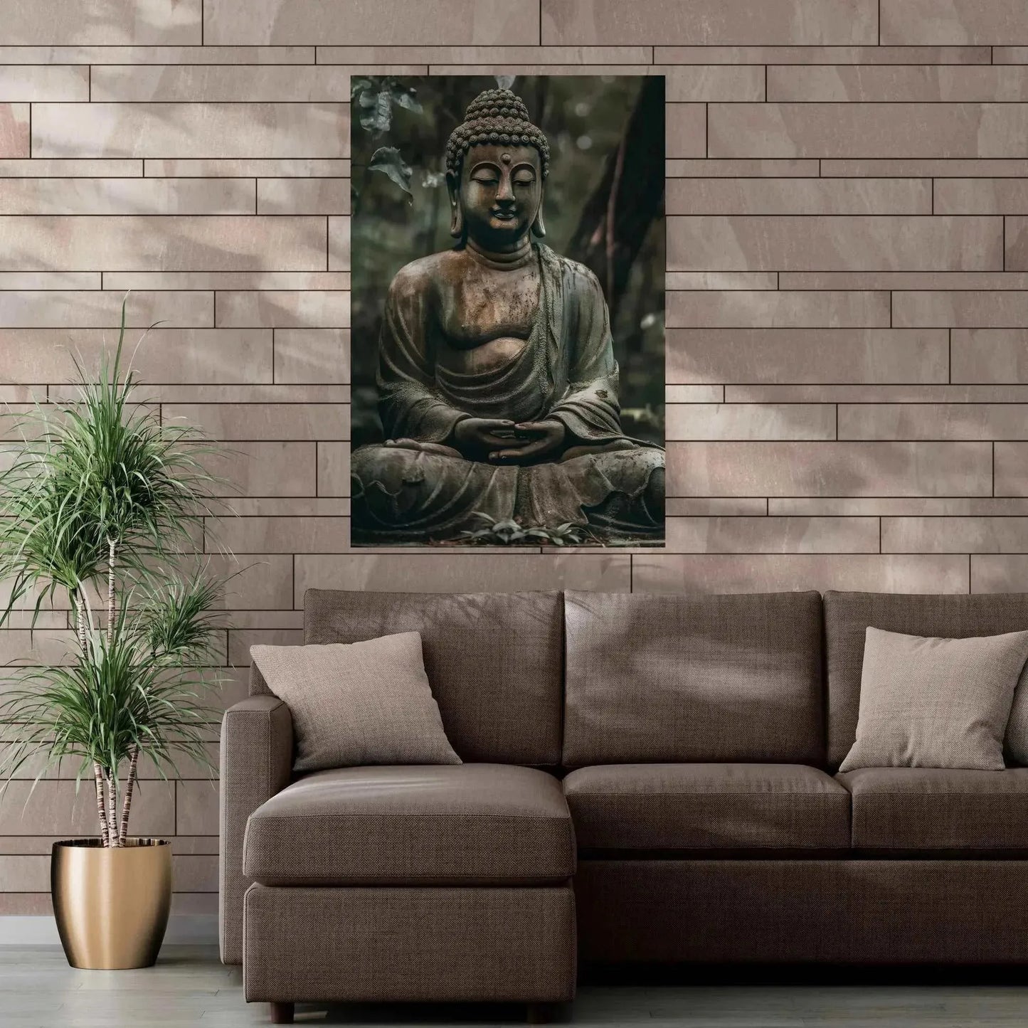 In a modern living room, a taupe sectional sofa with green cushions stands out against a textured beige wall. A large framed piece titled "Buddha in Meditation: ZenArtBliss.com's Fusion of Art and Spirituality," from Printify, is elegantly hung above the sofa. To the left, a potted plant adds to the serene atmosphere.