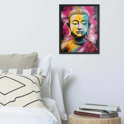A vibrant framed poster of a stylized Modern Buddha Painting hangs on a white wall above a neatly arranged bed with plush pillows and a decorative cushion. A bedside table to the right holds a stack of books beside a white bed covered in crisp linen. A wooden tray with a black bowl and a jar rests on the bed, adding a homely touch to the modern, serene bedroom setting.