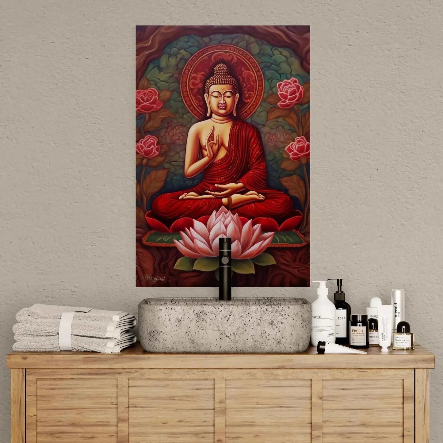 A serene bathroom setup features a wooden cabinet adorned with toiletries and towels. On the wall above, an artwork titled "Sitting Buddha Print: A Striking Abstract from ZenArtBliss.com" by Printify is displayed. It showcases vibrant colors and lotus flowers, adding to the tranquil ambiance.