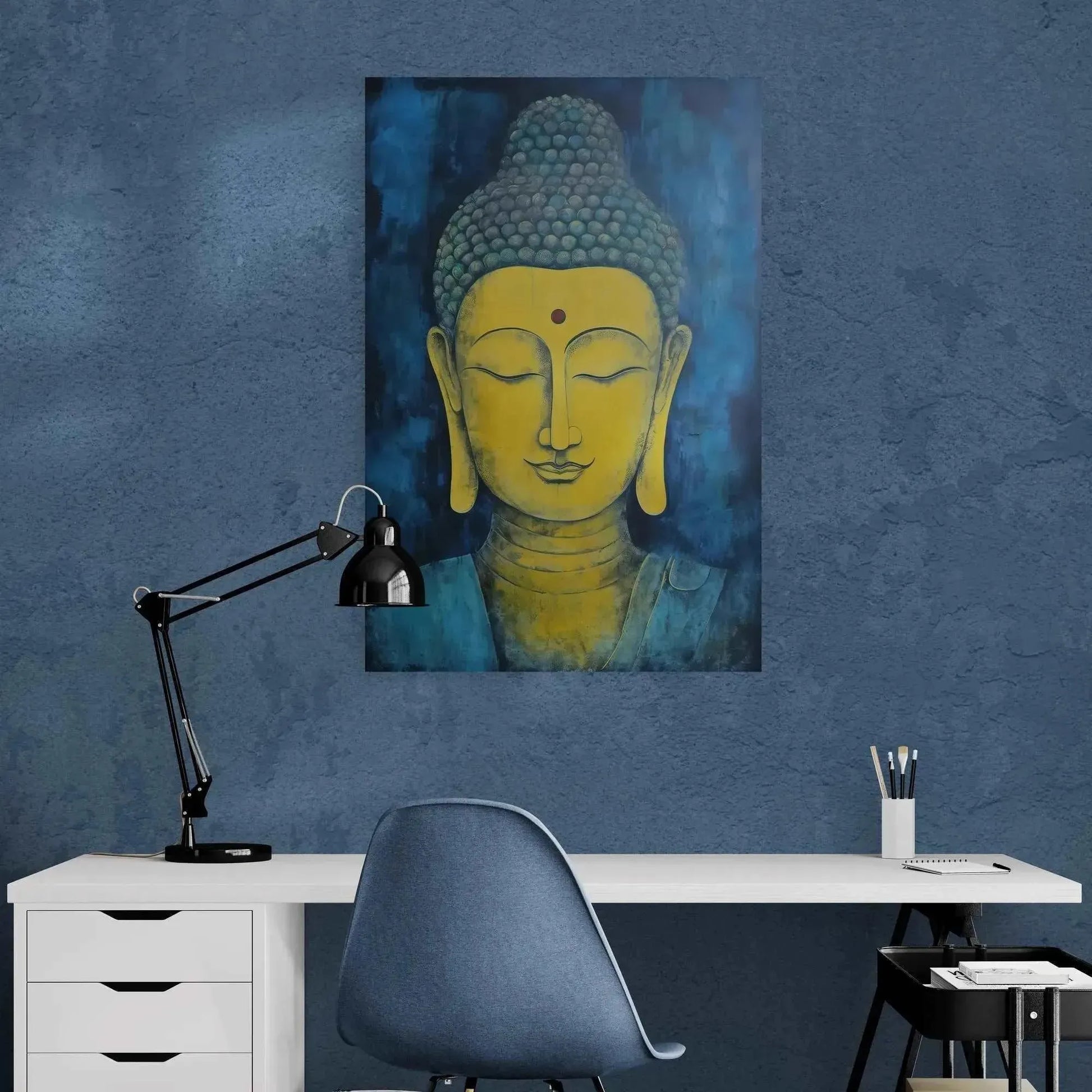 A minimalist office workspace with a white desk, black lamp, and blue chair exudes tranquility. On the wall hangs the Tranquil Buddha Meditation Art Poster – Kentucky's Zen Elegance by Printify, featuring a yellow face against a calming blue background, creating an atmosphere of Zen.